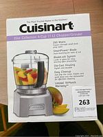 Photo of the boxed Cuisinart Elite Collection 4-Cup Chopper/Grinder showing front of the packaging with product image and feature details.