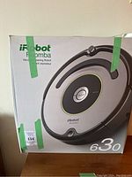 Box front showing iRobot Roomba 630 branding and image of the vacuum cleaning robot