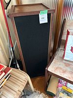 Two tall floor-standing speakers side by side