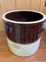 Front and side view showing the two tone glaze and overall shape of the ceramic crock.