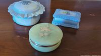 Set of three vintage trinket boxes: alabaster round box, rectangular ceramic box, and large round ceramic box