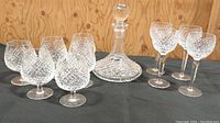 Overview of all pieces: 4 wine glasses, 6 brandy snifters, decanter with stopper