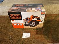 Box of Black+Decker 20V Max 5-1/2 inch Circular Saw sitting on carpet.
