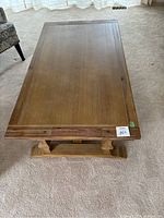 Top view of the rectangular wooden coffee table showing natural wood grain and edges.
