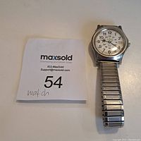 Full front view of Rodania Railroad Watch with metal expandable bracelet, white dial, and black numerals.