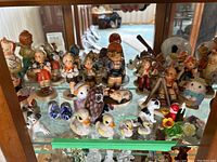 Front view of entire collection on one glass shelf