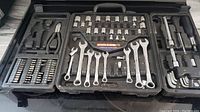 Full view of the open Fuller tool set showing wrenches, sockets, ratchets, screwdriver bits, and hex keys in molded black plastic case.