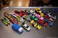 Overview of all 21 toy cars showing variety in type and color, placed on a tabletop.