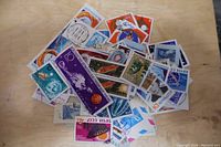 Loose collection of assorted used stamps from Russia including Soviet-era (CCCP) stamps with various colorful designs and cancellation marks.