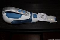 Close-up detail of Black & Decker logo and Lithium branding on vacuum body