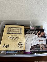 Overview of the calligraphy artist pad and calligraphy pen set with instructional materials.