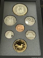 Front view of seven coins in the 1988 Canadian proof set displayed in protective foam holder.