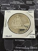 Obverse side of the 1999 Canadian silver proof dollar showing a sailing ship and inscriptions.