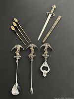 Set of 3 brass Buddha designed bar tool sticks, metal sword letter opener and sheath, and mid century brutalist anchor nautical bar tool set