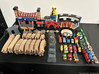 Overview of entire set showing wooden tracks, buildings, and train engines.