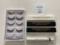 The full set showing 6 pairs of false lashes, 3 adhesive eyeliner kits (2 black, 1 clear), and 1 makeup remover pen.