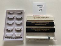 Overview of false lashes set, adhesive eyeliner kits (waterproof, 24hr lasting), and makeup remover pen all arranged on white background