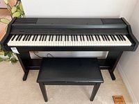 Front view of GEM novoPiano DP-30 on stand with bench