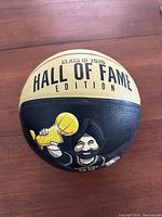 Front side of basketball showing caricature of Nav holding a trophy labeled 'GLASS OF 2020 HALL OF FAME EDITION'.