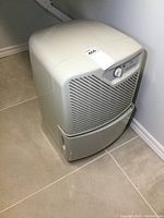 Front angle view showing the overall design and condition of the Simplicity 28 dehumidifier.
