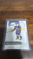 Front of Alex Ovechkin hockey trading card in protective sleeve showing player in Washington Capitals uniform.