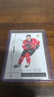 Front of Connor Bedard rookie hockey card, showing image and team details.