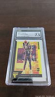 Close-up front image of the 2020-21 Panini Flux Immanuel Quickley rookie card graded 7.5 by CSG with label visible.