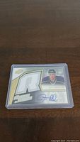 First Jeff Tambellini rookie card with autograph and large R-shaped jersey patch, numbered 01/399