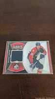 Front of Nathan Horton NHL jersey card showing player's image and fabric swatch.