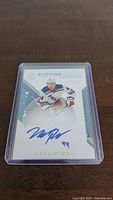Front view of Neal Pionk Future Watch autograph rookie hockey card in protective plastic case showing the autograph and serial number 086/199.