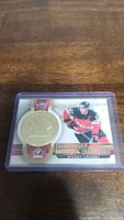 Front of Sidney Crosby Upper Deck Championship Medals hockey card showing player image and a large embedded medal replica