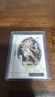 Front side of Victor Wembanyama rookie FIX basketball card showing player in action.