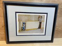 Full view of the framed print showing the entire artwork and frame.