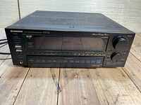 Full front view of black Pioneer VSX-D1S receiver showing control panel, buttons, and display.