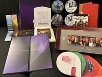 Overview photo of multiple FYC DVD discs and cases, showing packaging and disc art.