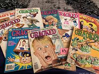 Lot of 10 Cracked magazines from early 1990s with various illustrated parody covers.