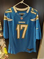 Front view of men's large blue San Diego Chargers football jersey with number 17 and NFL logo.