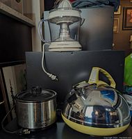 Photo shows electric juicer on top, mini Crock Pot slow cooker on the left, and vintage Baycrest kettle on the right.