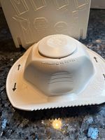 Close up of off white Borner slicer hand guard showing engraved safety instructions and Made in Germany mark