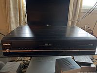Front view of Toshiba VHS HiFi stereo VCR/DVD combo player