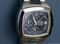 Close-up image of the Caravelle by Bulova men's chronograph watch face showing black dial, three subdials, date window, and branding.