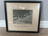Framed photo showing officers and men of 5th Field RCE on a rocky mountaintop with title and handwritten description visible.