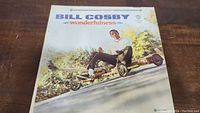 Front cover of the Bill Cosby Wonderfulness vinyl album showing Bill Cosby on a soapbox car outdoors.