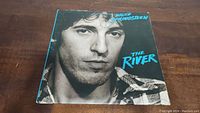 Front cover of Bruce Springsteen The River album showing close-up portrait of the artist.
