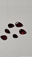 Six pear-shaped natural cherry red garnet gemstones from Mozambique, total carat weight 2.19ct, VS clarity.