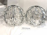 Pair of round light fixtures with chrome frames and hanging clear crystal teardrops arranged decoratively. Fixtures are about 9.5-10 inches diameter.