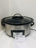 Front view of the Crock-Pot slow cooker showing the stainless steel body, glass lid with black handle, and digital control panel.