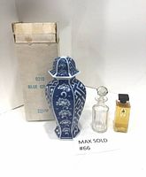 Full lot showing blue and white ceramic jar with original box, clear glass perfume bottle, and small cologne bottle