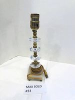 Front and angled views of the lamp showing brass socket, glass accents, and marble base with coiled cord.