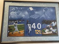Full view of framed Blue Jays sports print showing multiple player images and action poses along with numerical graphics
